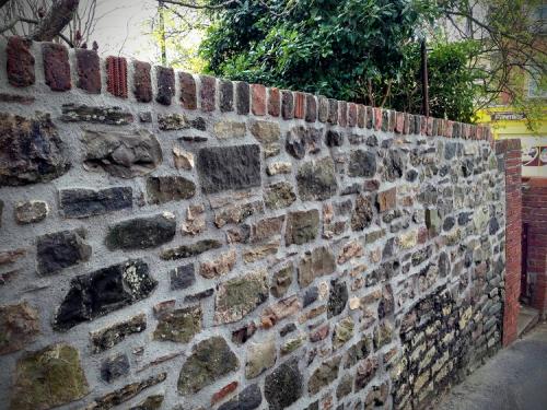 Stone wall rebuild with lime mortar Redland Bristol